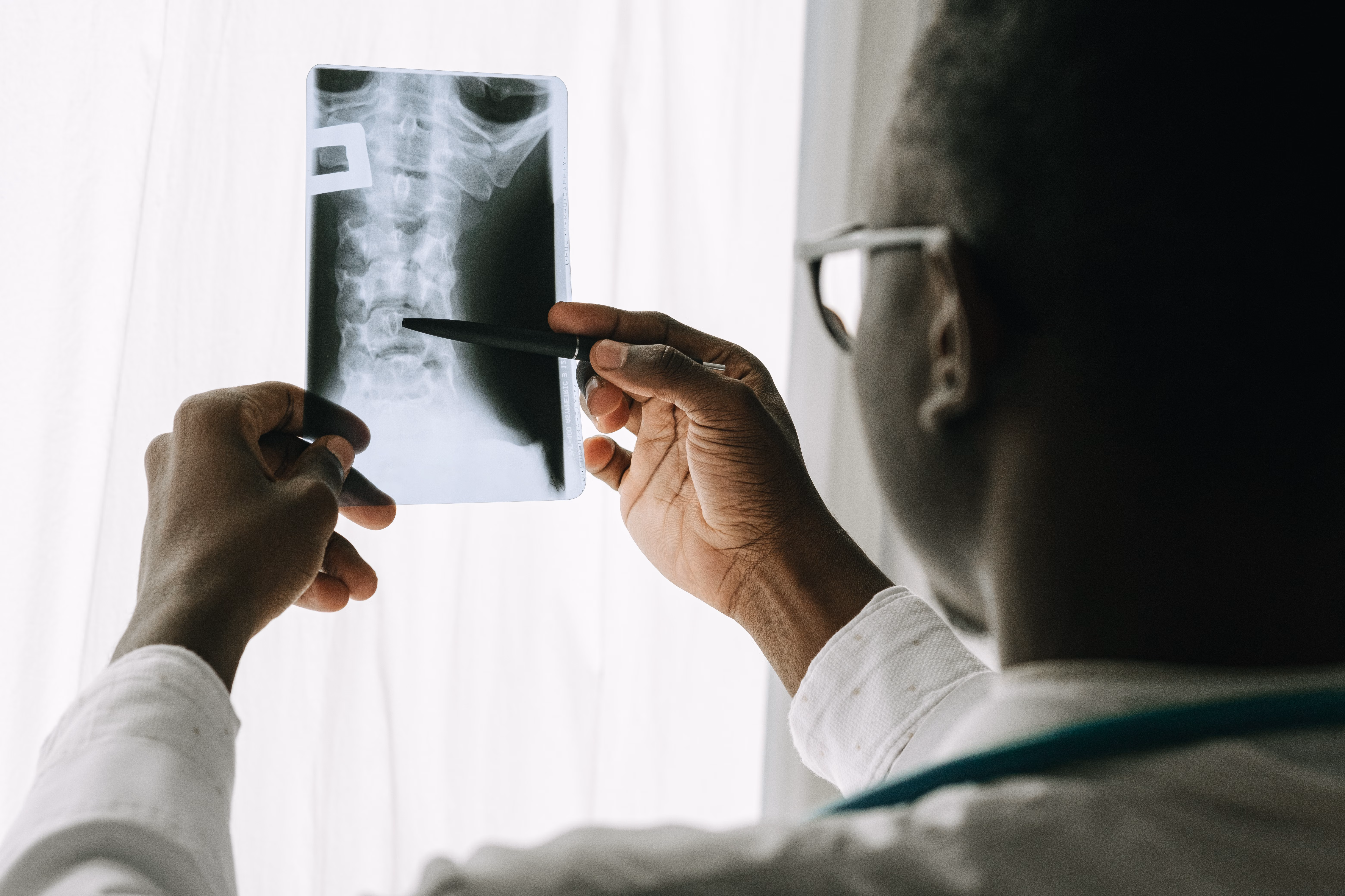 Doctor examining an X-ray image of an injury